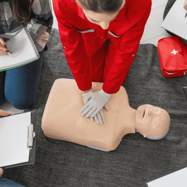 Employees participate in CPR training course.